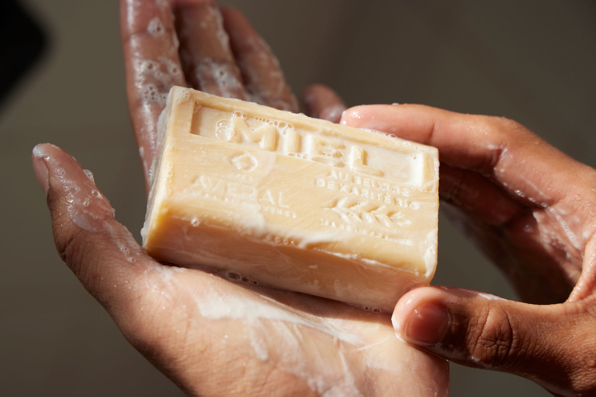Averal Provence Honey bar soap stamped Miel, lathered in wet hands